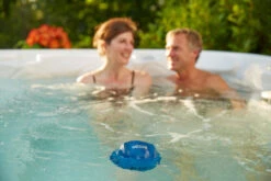 Spa FROG® @ease® Floating Sanitizer System 14 Spa FROG® @ease® Floating Sanitizer System -Swimming ease couple 97467.1697054464